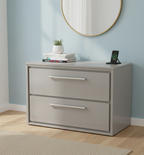 a two-drawer storage unit, identified by various retailers as a nightstand or a bathroom vanity unit, such as the Hudson Reed Lille vanity unit or the Kennedy Nightstand. 