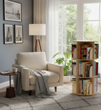 Living room with beige armchair, bookshelf, and large window