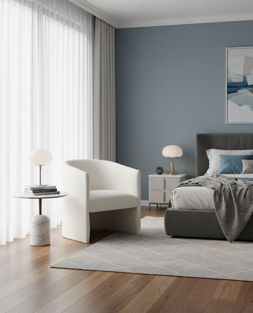  modern, well-lit bedroom with a serene color palette. A prominent feature is a large window wall covered in sheer white curtains, allowing natural light to fill the space. 