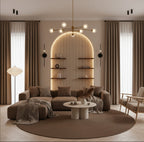 Modern living room with a brown sectional sofa, round coffee table, and decorative wall shelves.