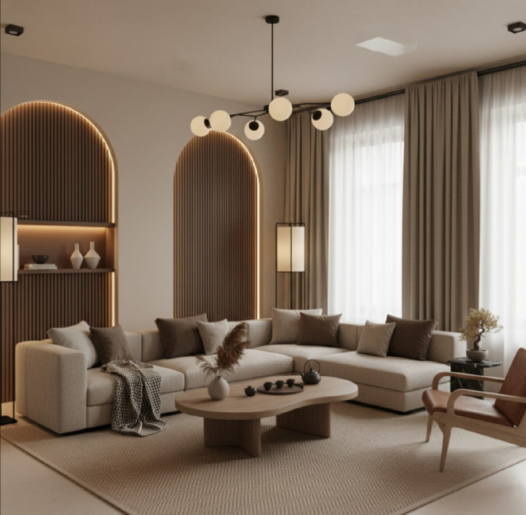 Modern living room with beige sectional sofa, coffee table, and decorative elements.